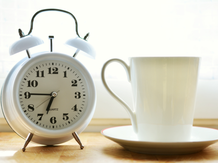 alarm clock and cup of coffee
